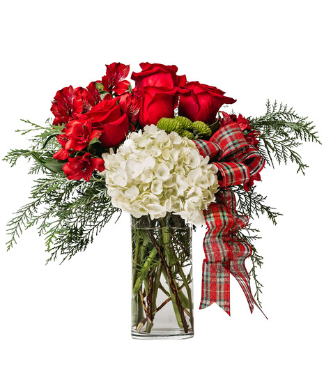Red Alstroemeria and Roses with white Hydrangea and plaid ribbon in a tall rectangular glass vase.
